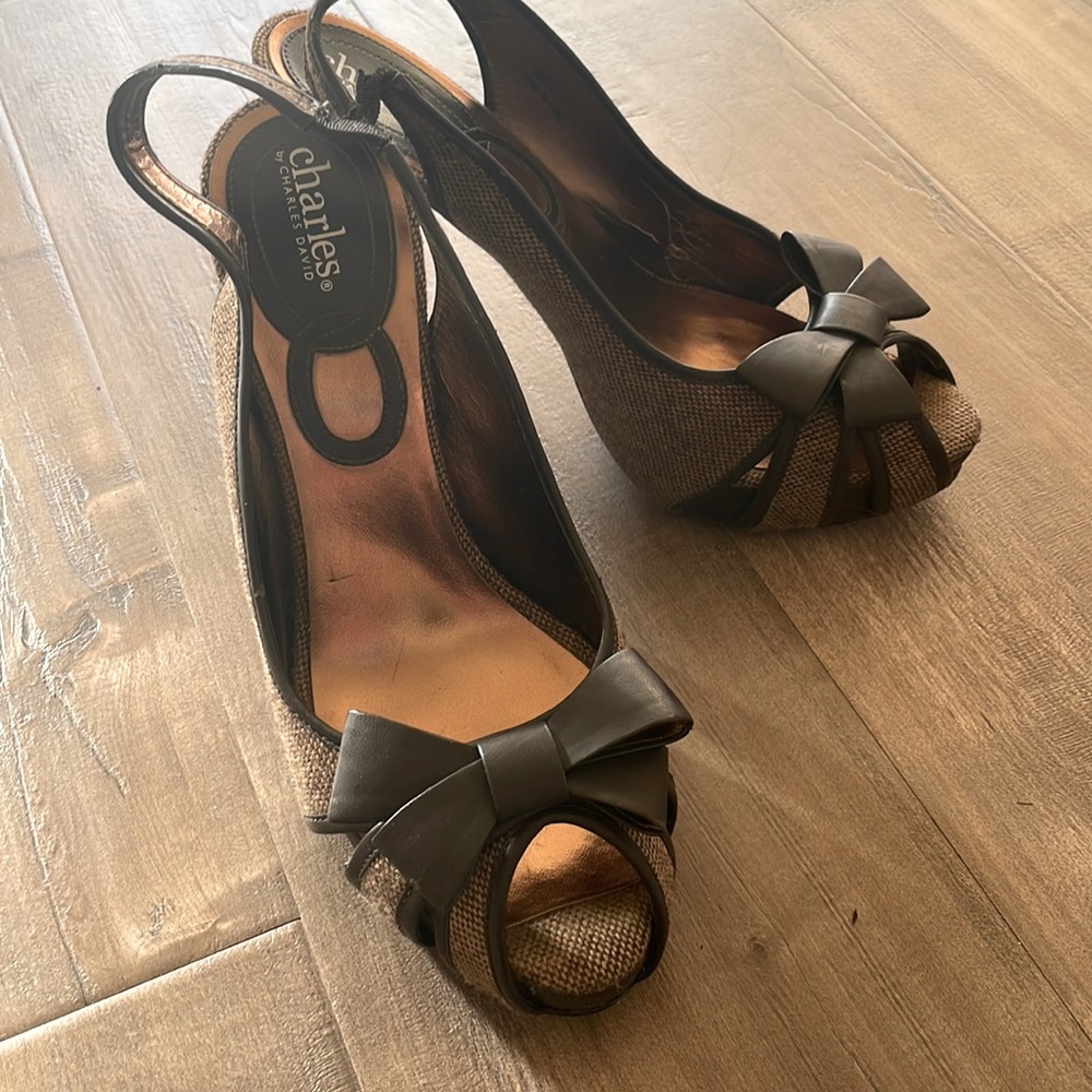 Brown and cream color shoes with a beautiful bow in the front